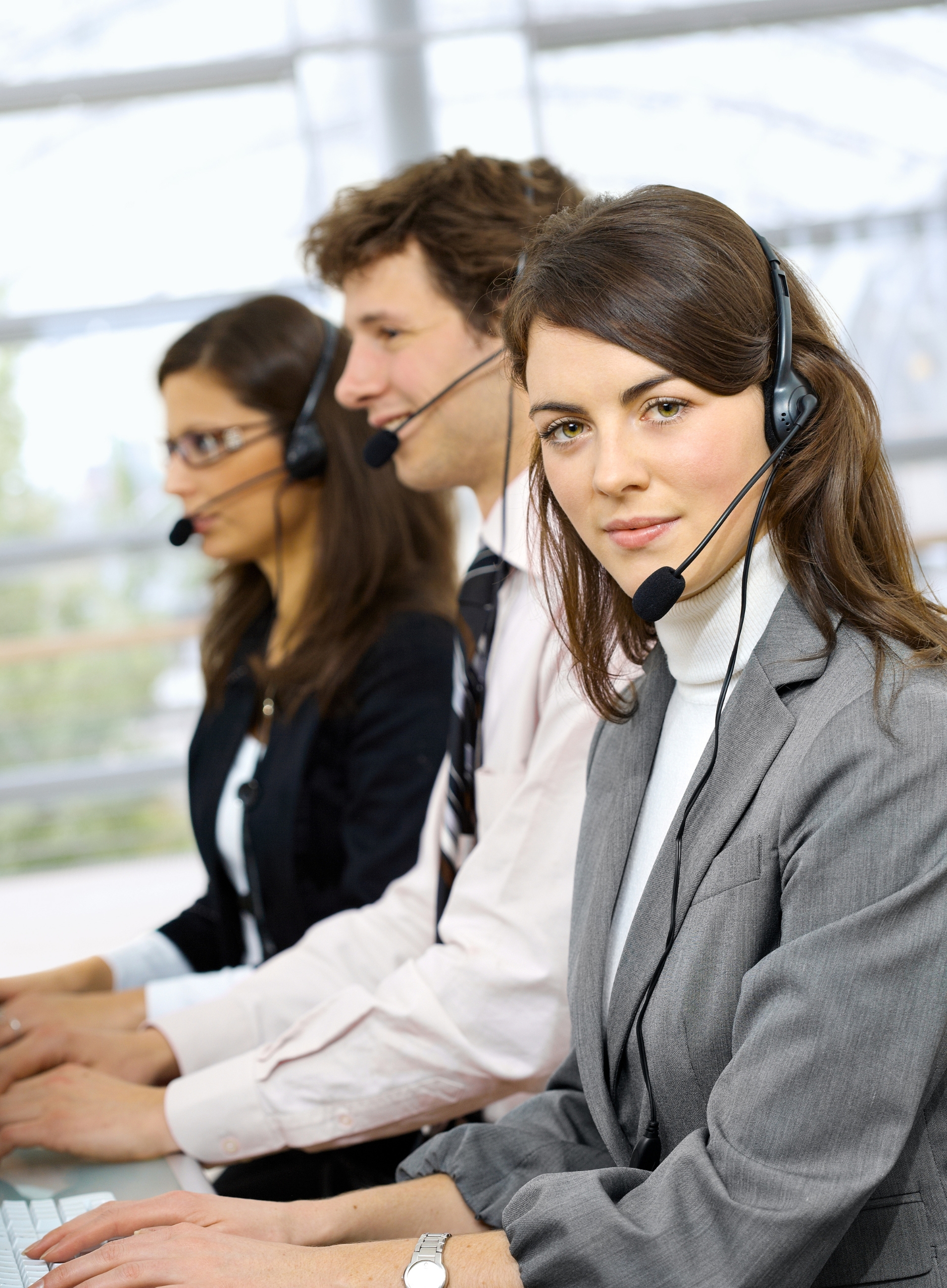 A modern call center setup optimized for small business support, with agents actively managing calls.