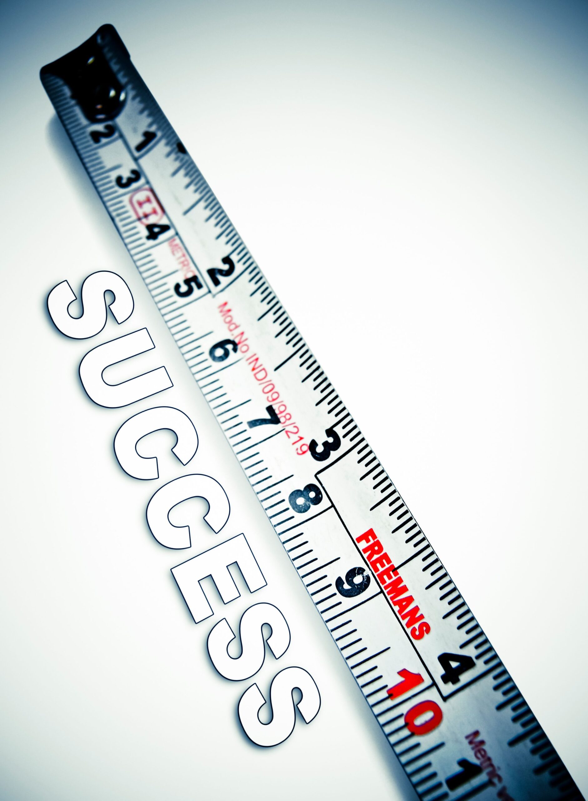 Measuring tape stretched above the word 'Success', symbolizing the measurement of web chat performance