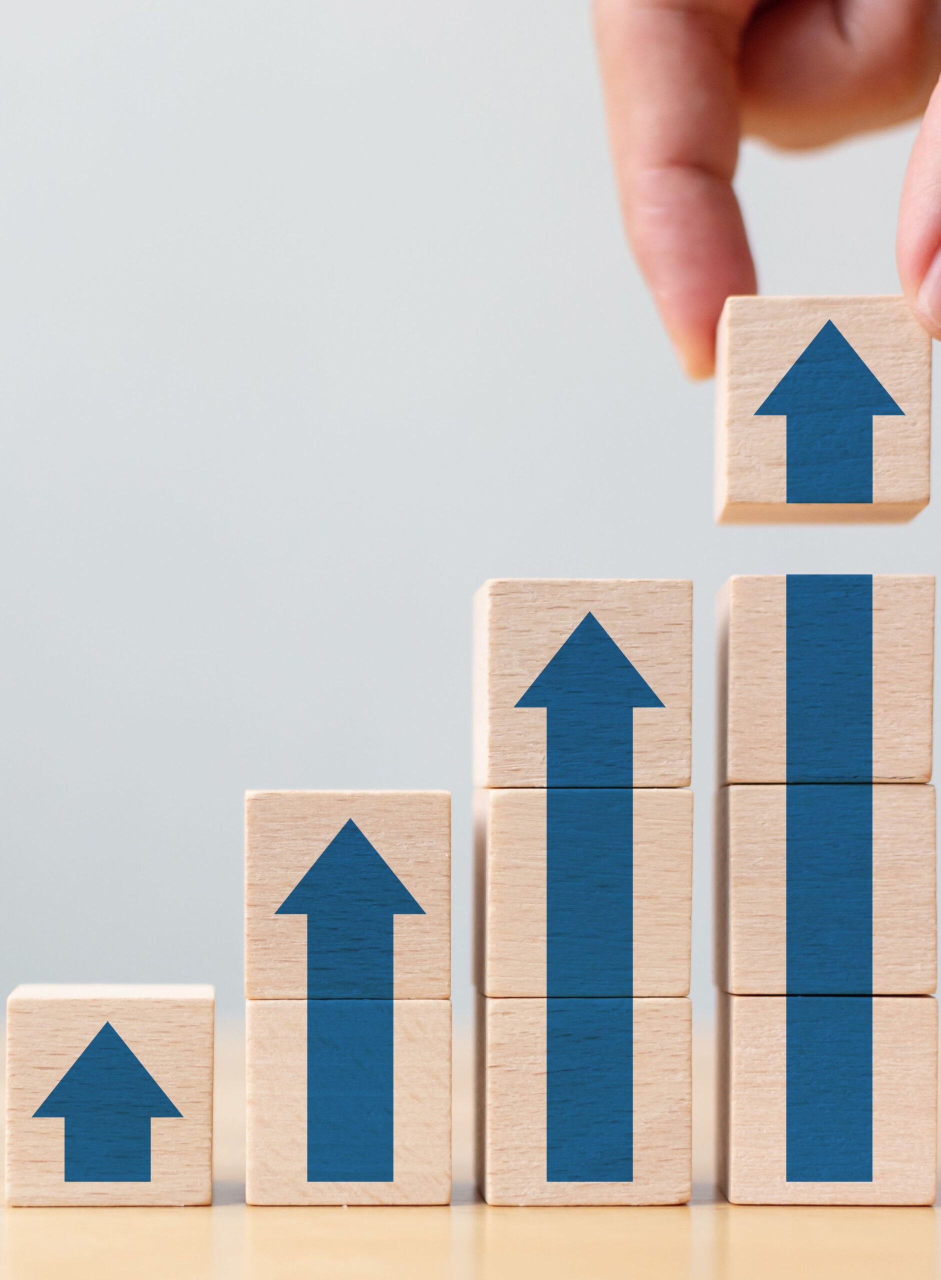 Illustration of wooden blocks forming an ascending line chart, symbolizing business growth strategies.